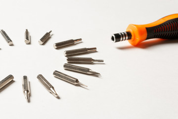 Home male instrument for repairing - different tips of screwdriver in circle and a main part. Multifunctional tool for home fixing 