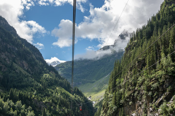 Closeup mountains scenes, cable car to Trift Bridge in national park Switzerland