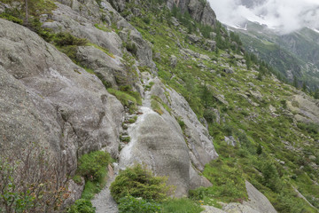 Closeup mountains scenes, walk to Trift Bridge in national park Switzerland