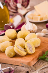 Potato gnocchi stuffed with radicchio and ricotta.