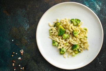 pasta broccoli, vegetarian dish (main course with vegetables Cavatappi, Elbow) menu concept. food background. top view. copy space