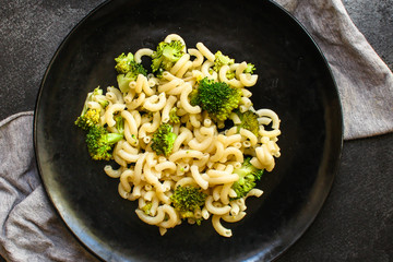 pasta broccoli, vegetarian dish (main course with vegetables Cavatappi, Elbow) menu concept. food background. top view. copy space