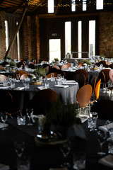 Food served on round table in a white hall during a Birthday corporate party in Eastern European Baltic Riga Latvia - Wooden ambar hall in countryside style - Canape, snacks and light drinks