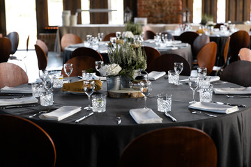 Food served on round table in a white hall during a Birthday corporate party in Eastern European Baltic Riga Latvia - Wooden ambar hall in countryside style - Canape, snacks and light drinks