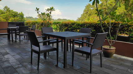 plastic weave table and chairs in the terrace