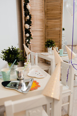 Food served on table in a white hall during a children Birthday party decoration in Eastern European Baltic Riga Latvia - Mild Biege, creme, pink colors - Canape, snacks and light drinks