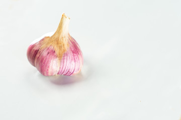 Head of dried blue garlic on a white background.