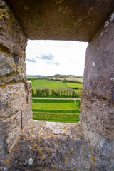 View through Carisbrooke Castle window to england rural landscape, Isle of Wight, England