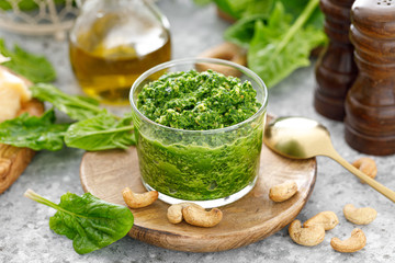 Spinach pesto sauce with cashew, parmesan cheese and olive oil