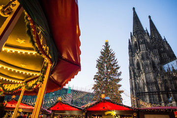 Traditional Christmas market in Europe, Cologne, Germany. Main town square with decorated tree and...