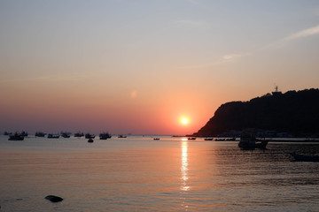 Evening sunset on the sea, there is a shadow fishing boat