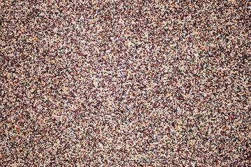 Small stone wall texture background. Stone wall made of small color pebbles abstract texture background for pattern, graphic design, print, web design backgrounds, wallpaper or banner template