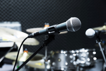 Professional condenser studio microphone, Musical Concept. recording, selective focus  microphone in radio studio, selective focus microphone and blur musical equipment guitar ,