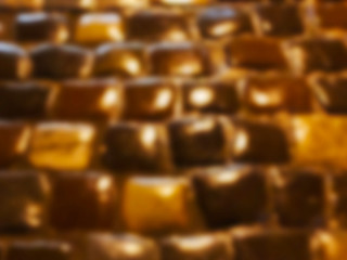 Fototapeta premium Blurred background of night paving stones. Bright abstract background