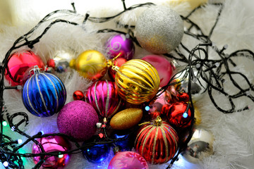 Christmas colorful shiny Cristmas balls with shimmering garland and fluffy decor