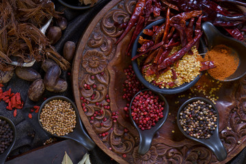Thai ingredient in plate on black cloth and table.