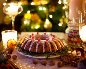 Traditional Christmas cake with dried fruits, raisins and nuts with Christmas decoration
