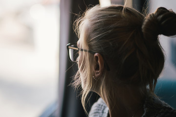 Close up profile view of smiling woman, dreaming of future perspective and goal achievements, happy female look far in distance at window, imagining successful career.