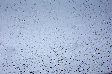 Drops of condensed water on glass. rainy weather