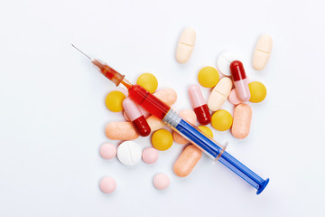 health and medicine, pills and syringe