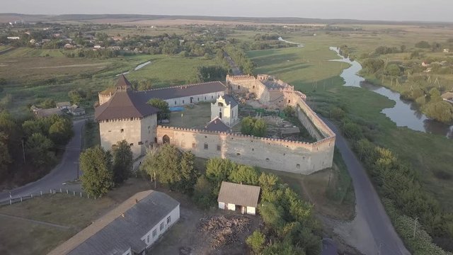 Aerial to Medzhybizh Castle and Church of St. Nicholas, one of the strongest fortres of the Crown of the Kingdom of Poland in Podolia. It is situated at confluence of Southern Bug rivers, Ukraine