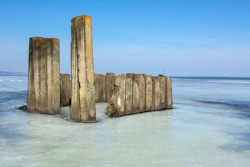 old breakwater in the river - 308255314