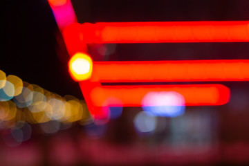 neon blur the background.the city lights at night.red