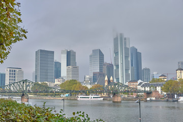 Fototapeta premium Scenic view of Frankfurt am Main - metropolis and largest city of german federal state of Hesse in Germany. Beautiful summer look of downtown of big german financial city