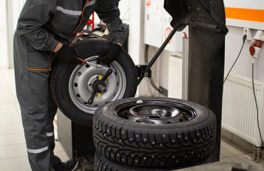 Tire service.Balancing the wheels of the car in the workshop.