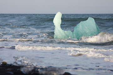 Iceberg Drifting In The Surf, Iceland