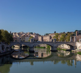 Fototapeta na wymiar One of the Roman bridges in Italy over the Tiber