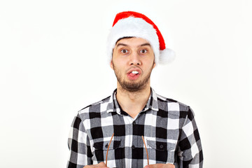 Holidays and presents concept - Funny emotional man in Christmas hat on white background