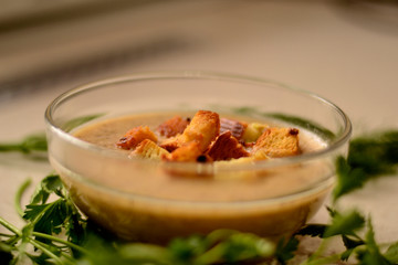 Mushroom soup with vegetables, garlic croutons and herbs