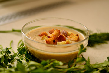 Mushroom soup with vegetables, garlic croutons and herbs