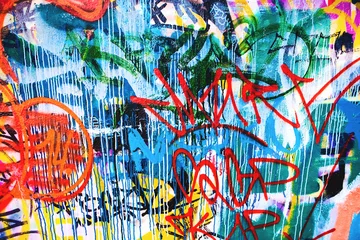 Photo sur Aluminium Graffiti Gros plan de la texture du mur urbain coloré endommagé