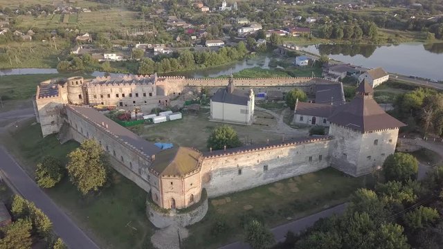 Aerial to Medzhybizh Castle and Church of St. Nicholas, one of the strongest fortres of the Crown of the Kingdom of Poland in Podolia. It is situated at confluence of Southern Bug rivers, Ukraine