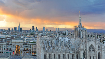 Italy Milan -  skyline of the city - Duomo Cathedral and new skyscrepers building during a sunset