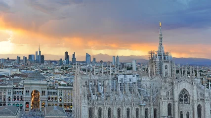 Papier Peint photo Milan Italy Milan -  skyline of the city - Duomo Cathedral and new skyscrepers building during a sunset
