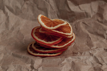 dried slices of orange on craft paper