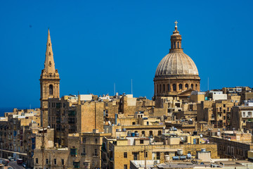 Fototapeta na wymiar Two churches in Valletta, Malta