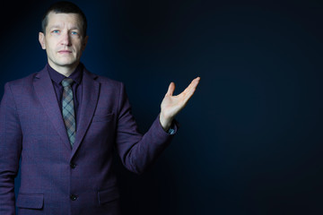 business, office, advertising and people concept - business man showing something with his hand