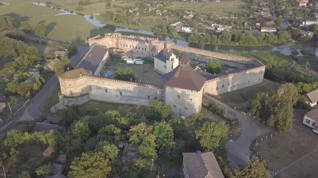 Aerial to Medzhybizh Castle and Church of St. Nicholas, one of the strongest fortres of the Crown of the Kingdom of Poland in Podolia. It is situated at confluence of Southern Bug rivers, Ukraine