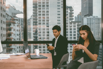 Group of business people working and communicating while sitting at the office desk together background.