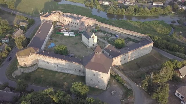 Aerial to Medzhybizh Castle and Church of St. Nicholas, one of the strongest fortres of the Crown of the Kingdom of Poland in Podolia. It is situated at confluence of Southern Bug rivers, Ukraine