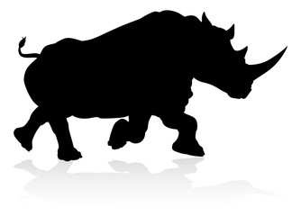 Obraz na płótnie Canvas A rhino or rhinoceros safari animal silhouette
