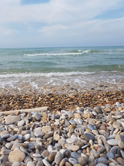 Waves breaking on a beach with stones
