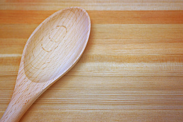 Wooden spoon on wooden table
