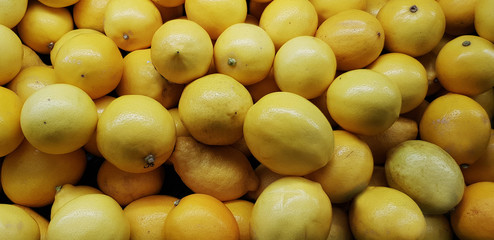lemons sold in a store on the counter