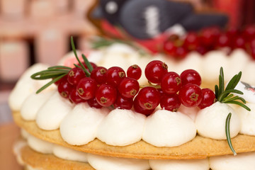 Beautiful birthday cake decorated with decor and fresh berries