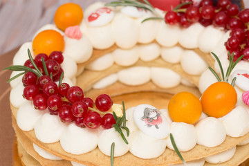 Beautiful birthday cake decorated with decor and fresh berries